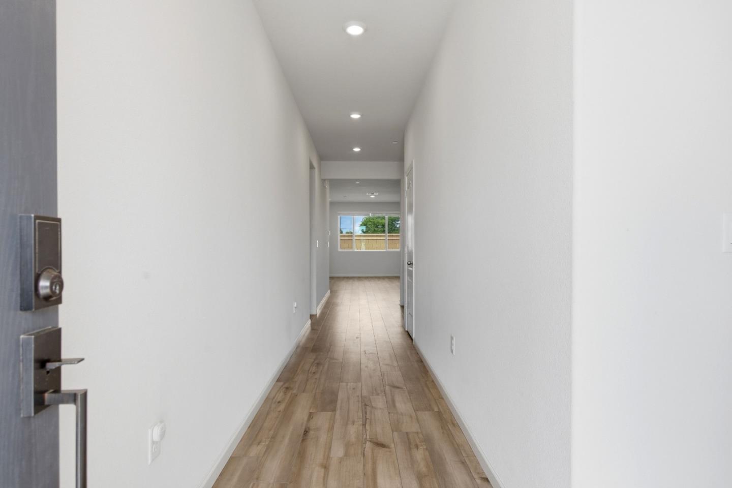 331 Lolly Way Los Banos, CA 93635 - Photo 6 of 31 a view of a hallway with wooden floor