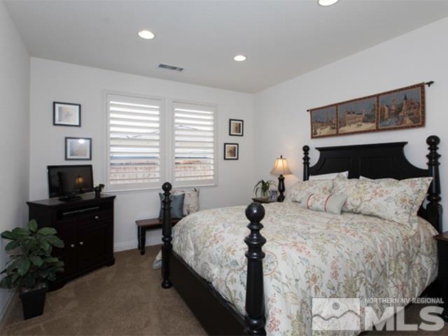 2035 Back Nine Trail Reno, NV 89523 - Photo 14 of 25 a bedroom with a bed and a potted plant
