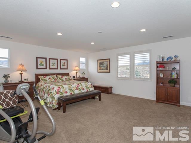 2035 Back Nine Trail Reno, NV 89523 - Photo 10 of 25 a bedroom with a bed and lamp
