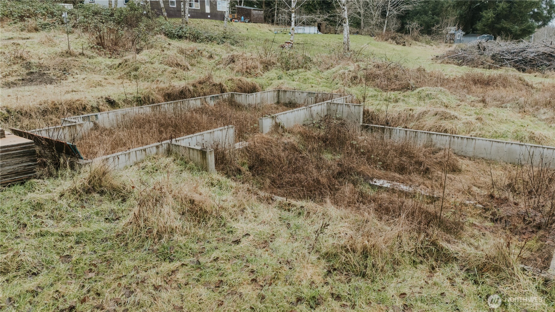 215 Elk Creek Ridge Road Forks, WA 98331 - Photo 17 of 37 a view of a dry yard with wooden floor and fence