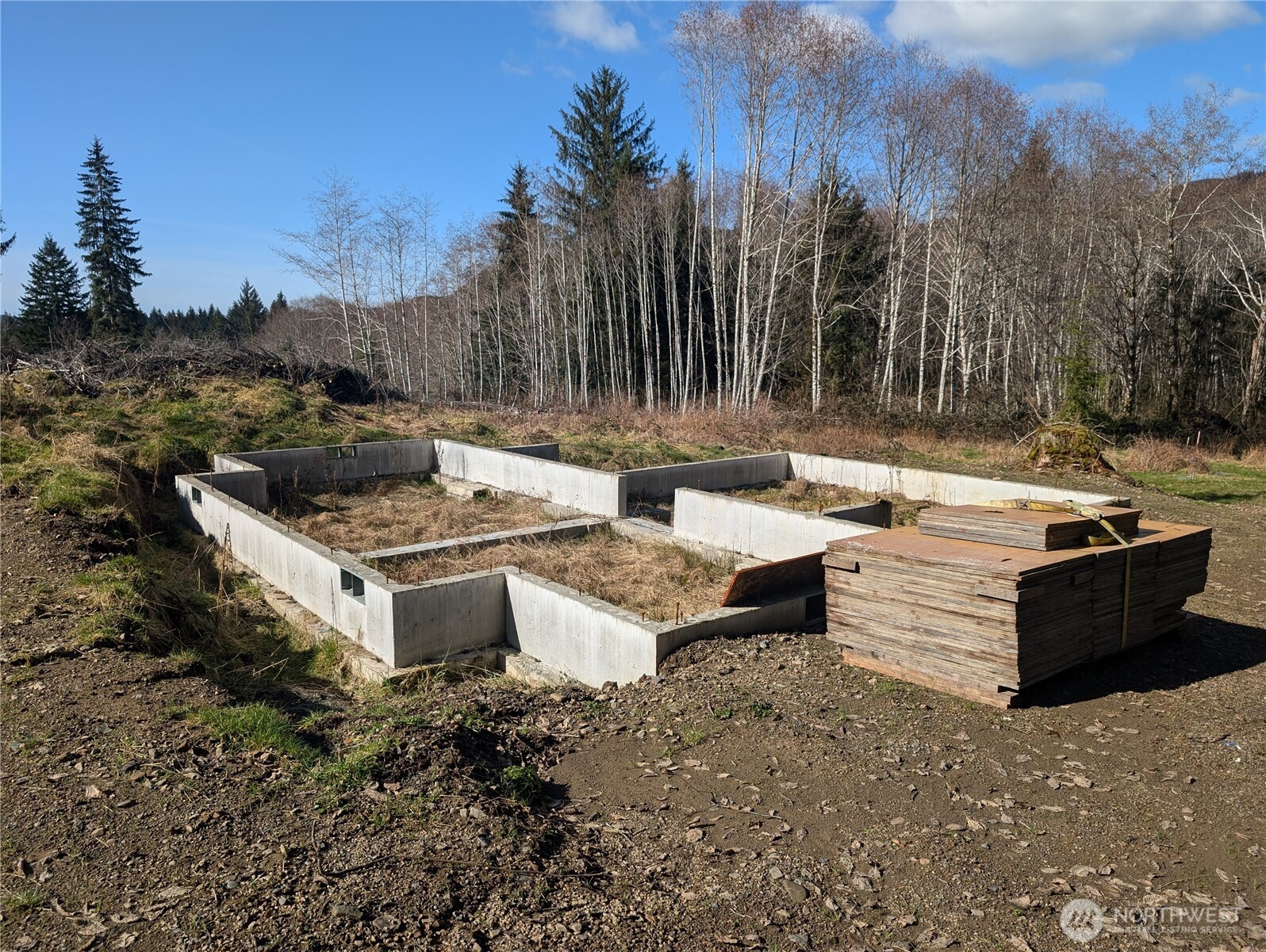 215 Elk Creek Ridge Road Forks, WA 98331 - Photo 22 of 37 a view of a fire pit with a yard