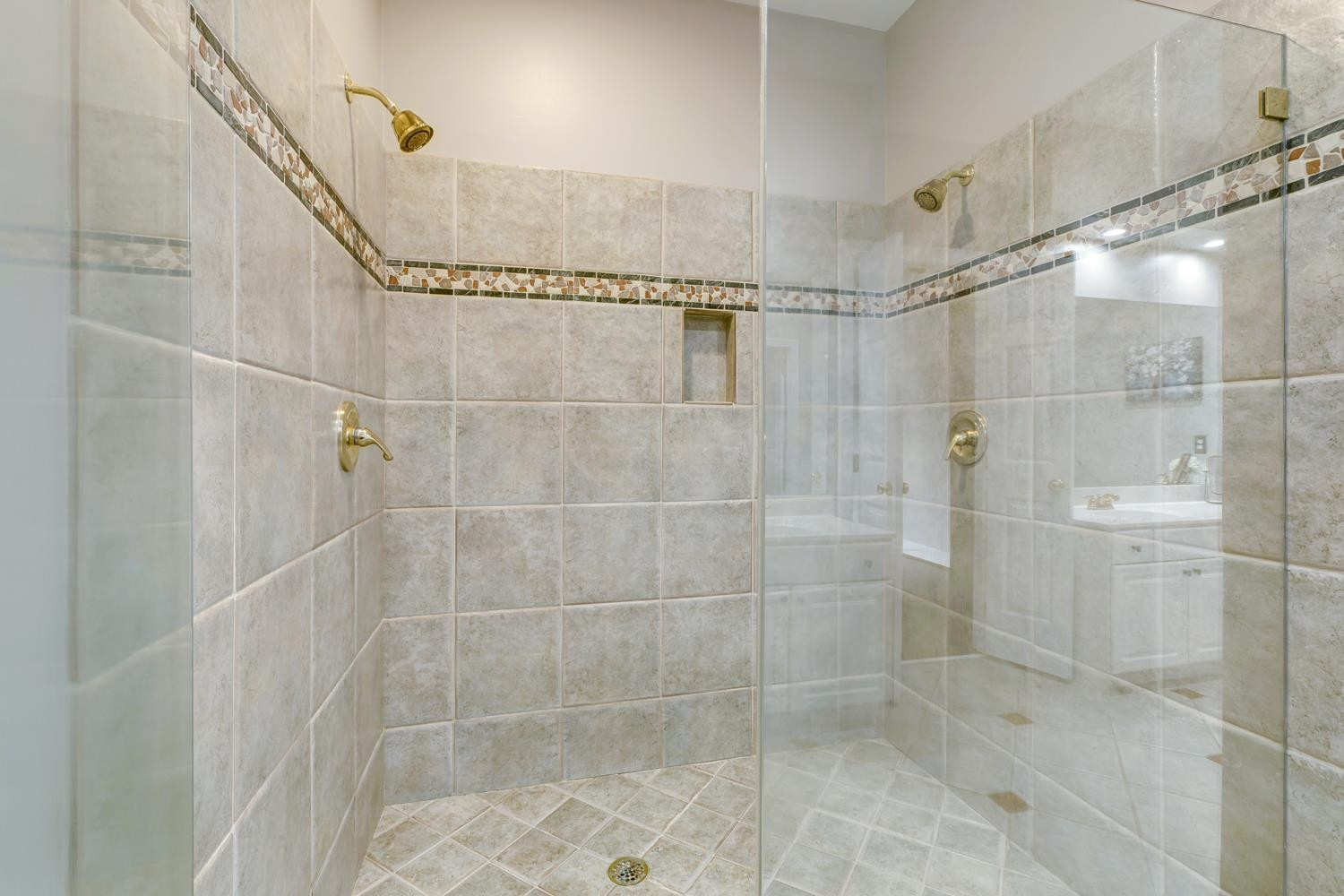 The WALK IN SHOWER has beautiful tile work and also has DUAL shower heads; plenty of room for a nice relaxing shower after a long day. Owners Shower