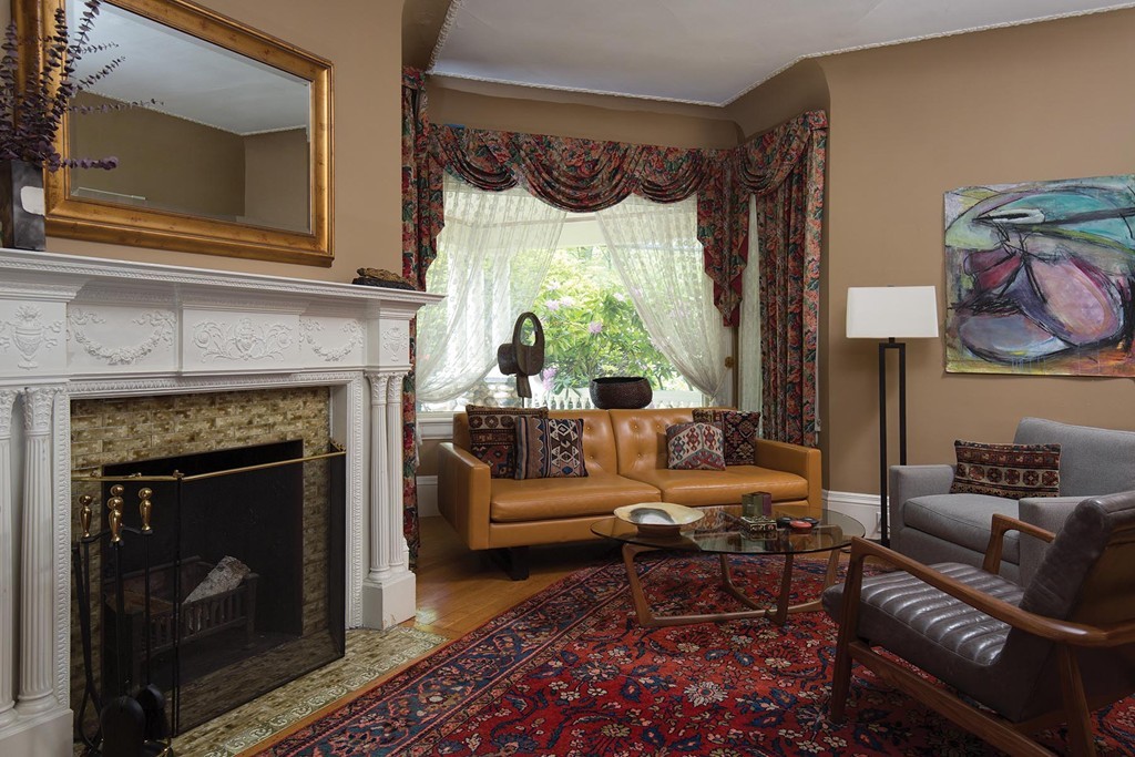 127 Naples Road Brookline, MA 02446 - Photo 3 of 11 a living room with furniture and a fireplace