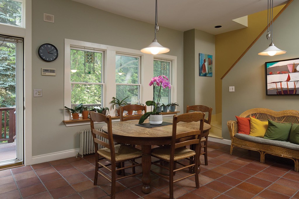 127 Naples Road Brookline, MA 02446 - Photo 6 of 11 a view of a dining room with furniture and a large window