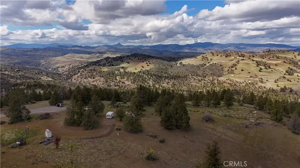 a view of a town with mountains in the background