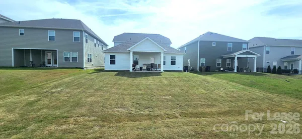 a view of a yard in front of the house