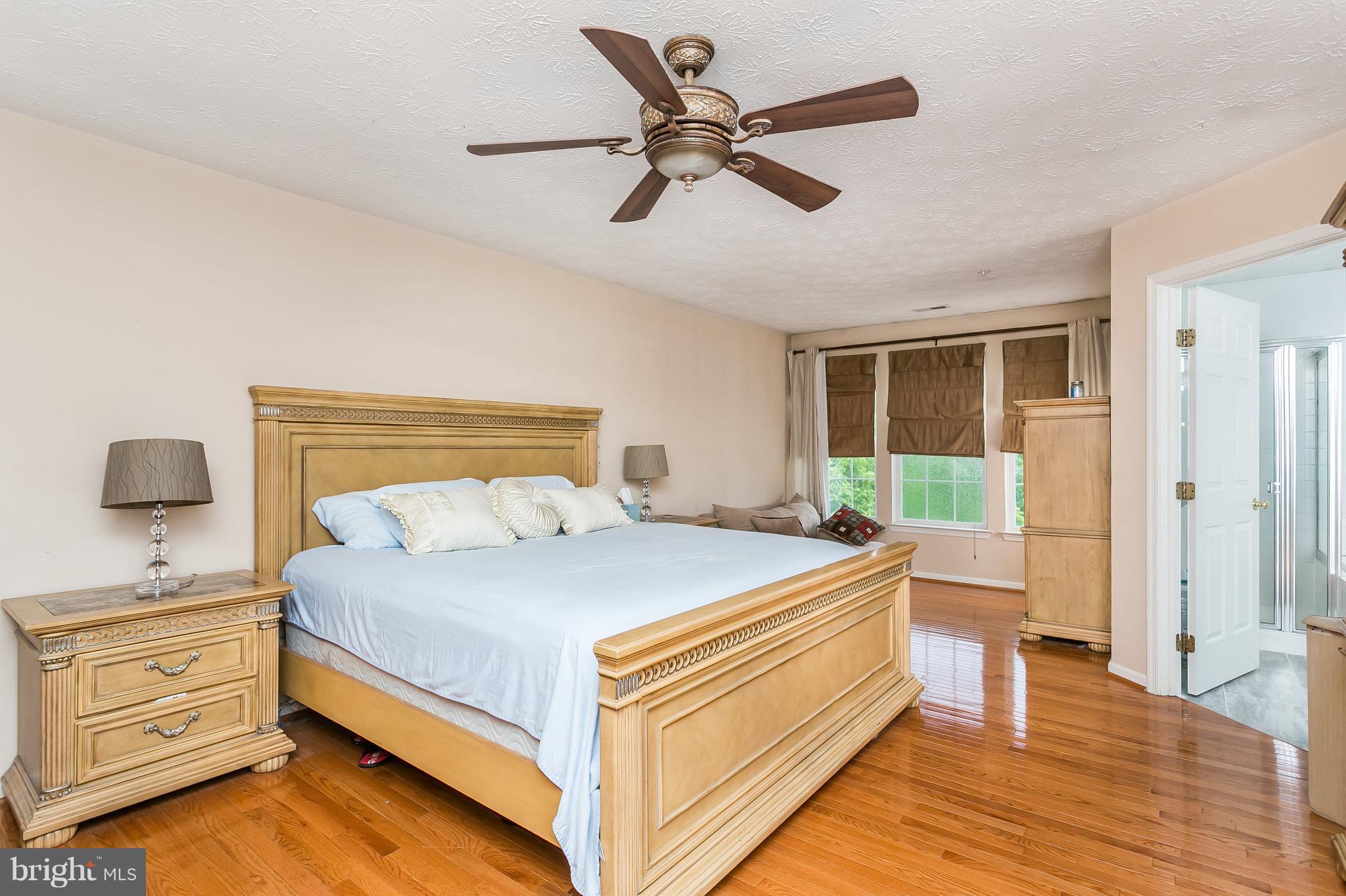 5143 Spring Willow Court Owings Mills, MD 21117 - Photo 15 of 29 Master Bedroom with Beautiful Hardwood Foors