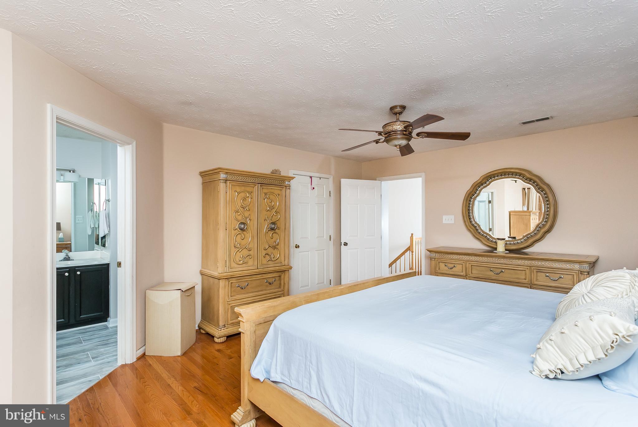 5143 Spring Willow Court Owings Mills, MD 21117 - Photo 16 of 29 Master Bedroom with Beautiful Hardwood Foors