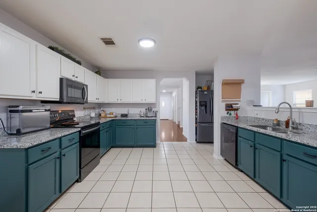 a large kitchen with cabinets