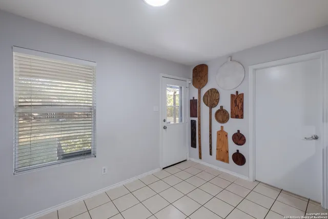 a view of an empty room with windows