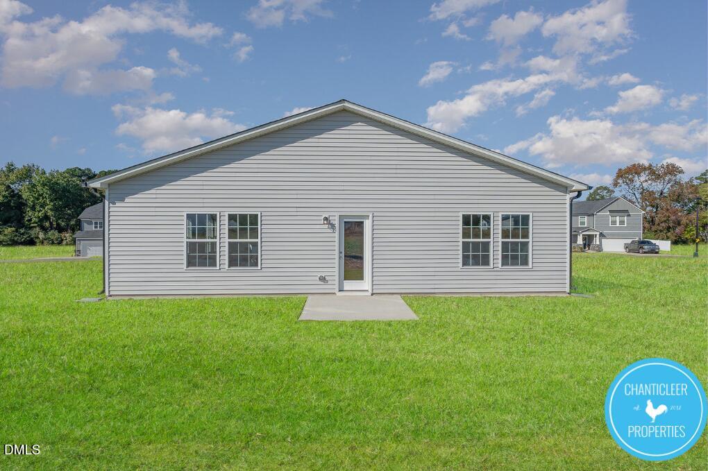 66705 Hardwick Lane Sims, NC 27880 - Photo 17 of 18 a front view of house with yard and green space