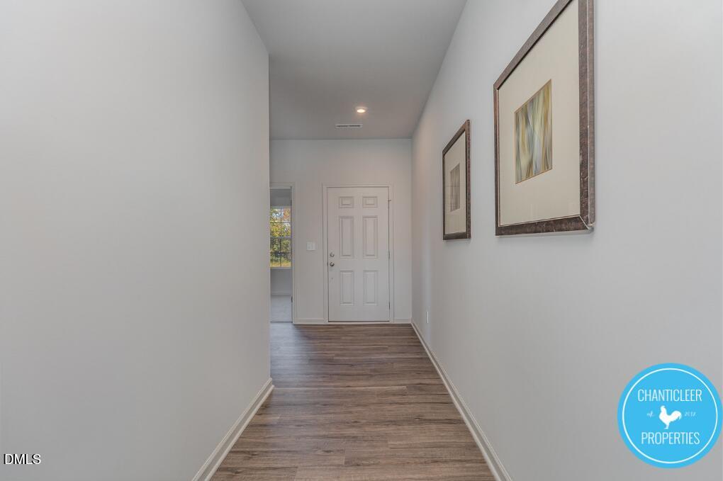 66705 Hardwick Lane Sims, NC 27880 - Photo 3 of 18 a view of a hallway with wooden floor
