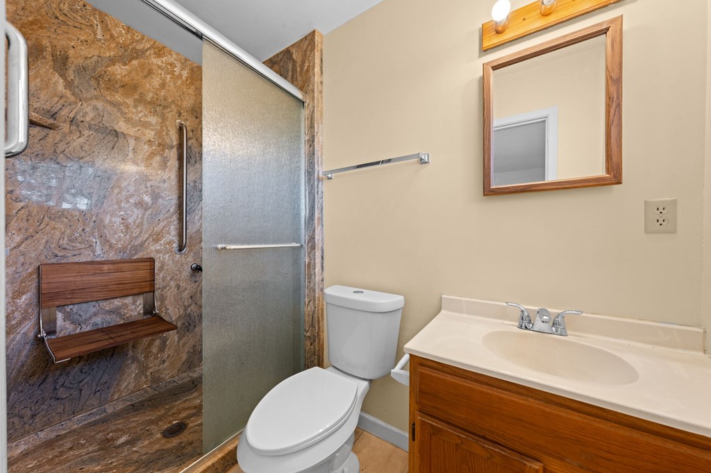 4317 Highway 173 Bandera, TX 78003 - Photo 11 of 35 a bathroom with a sink a toilet and shower