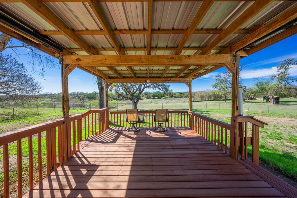 4317 Highway 173 Bandera, TX 78003 - Photo 16 of 35 a view of a balcony with wooden floor