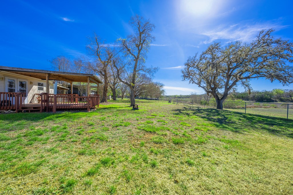 4317 Highway 173 Bandera, TX 78003 - Photo 19 of 35 a view of a house with backyard and a tree