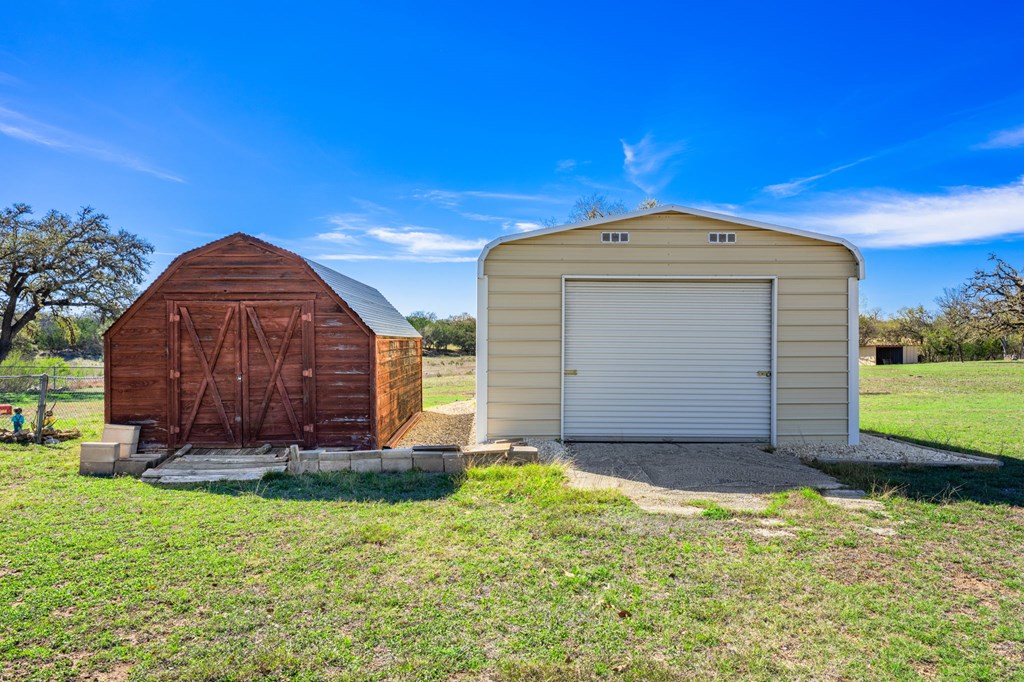 4317 Highway 173 Bandera, TX 78003 - Photo 21 of 35 a front view of a house with garden