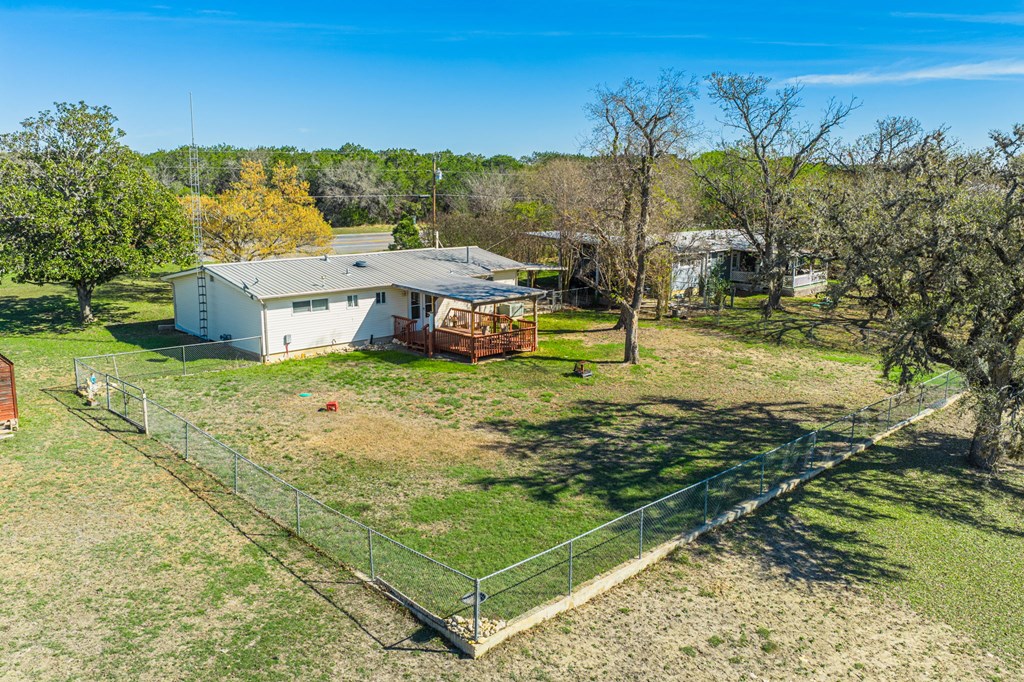 4317 Highway 173 Bandera, TX 78003 - Photo 26 of 35 a view of a house with a yard