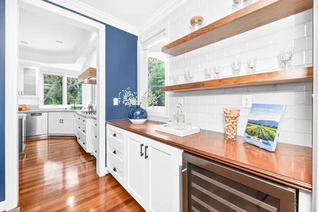 a kitchen with stainless steel appliances a sink and cabinets
