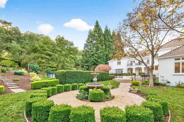 a view of a garden with a fountain