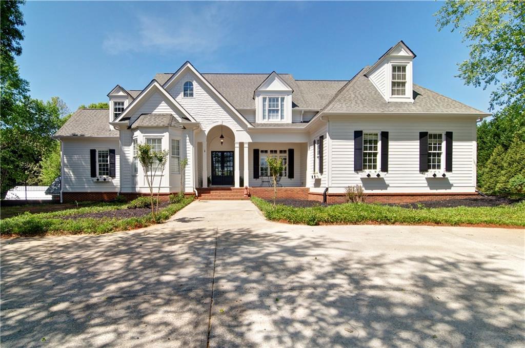 154 Peeples Road Fayetteville, GA 30215 - Photo 1 of 1 View of front of property featuring covered porch
