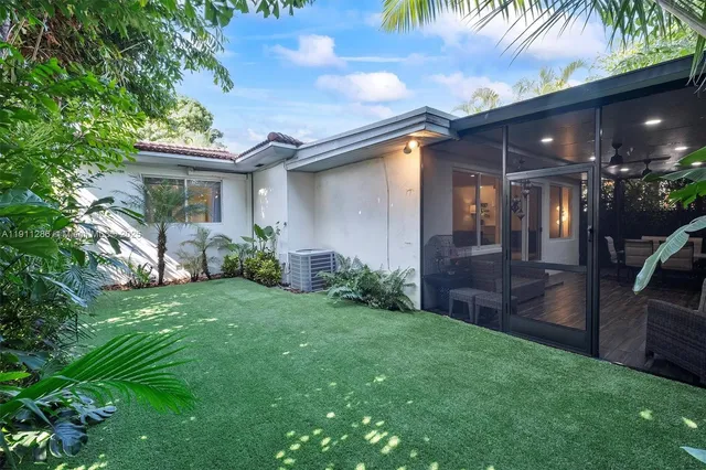a backyard of a house with seating space