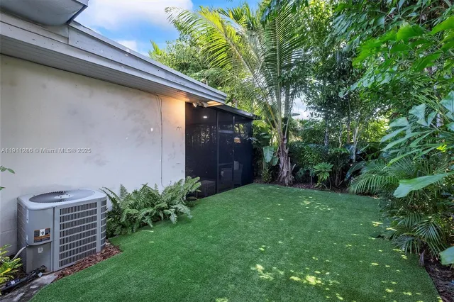 a backyard of a house with lots of green space