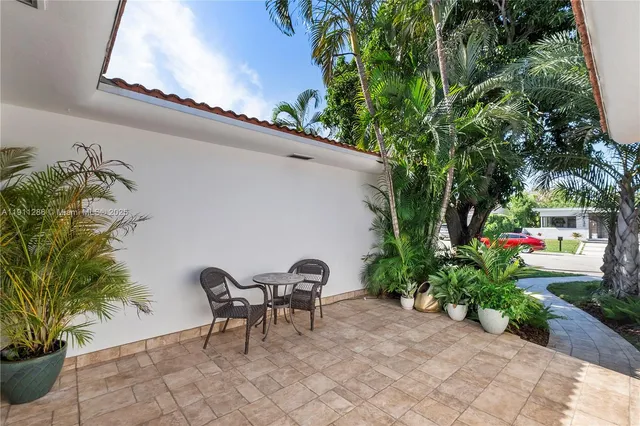 a couple of table and chairs in patio