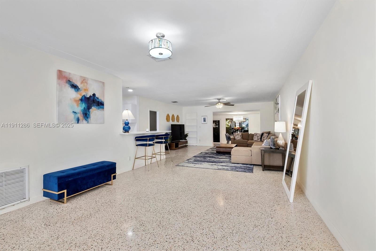 9049 Dickens Avenue Surfside, FL 33154 - Photo 4 of 34 a living room with furniture and a couch