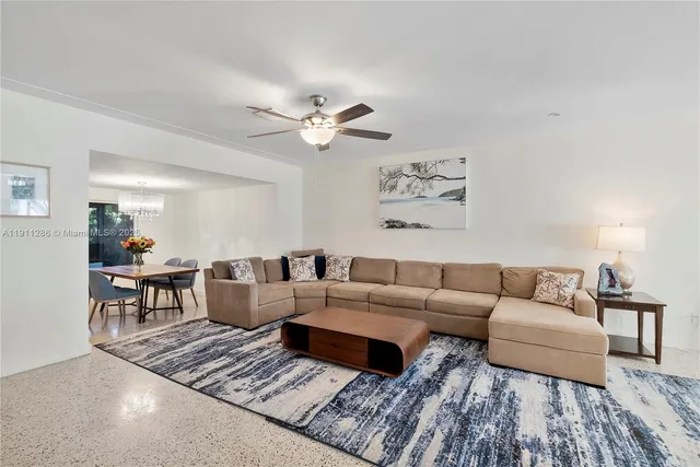 a living room with furniture and a rug