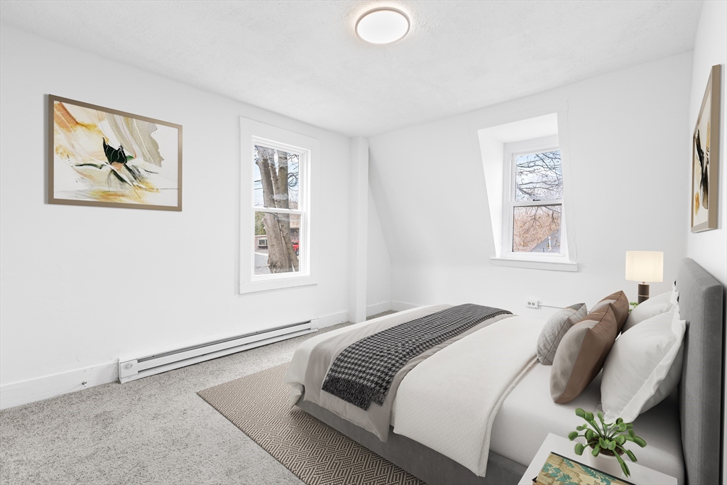 528 Walker Street Lenox, MA 01242 - Photo 8 of 13 a bedroom with a bed and a painting on the wall