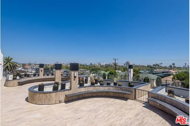 a view of a swimming pool and a back yard