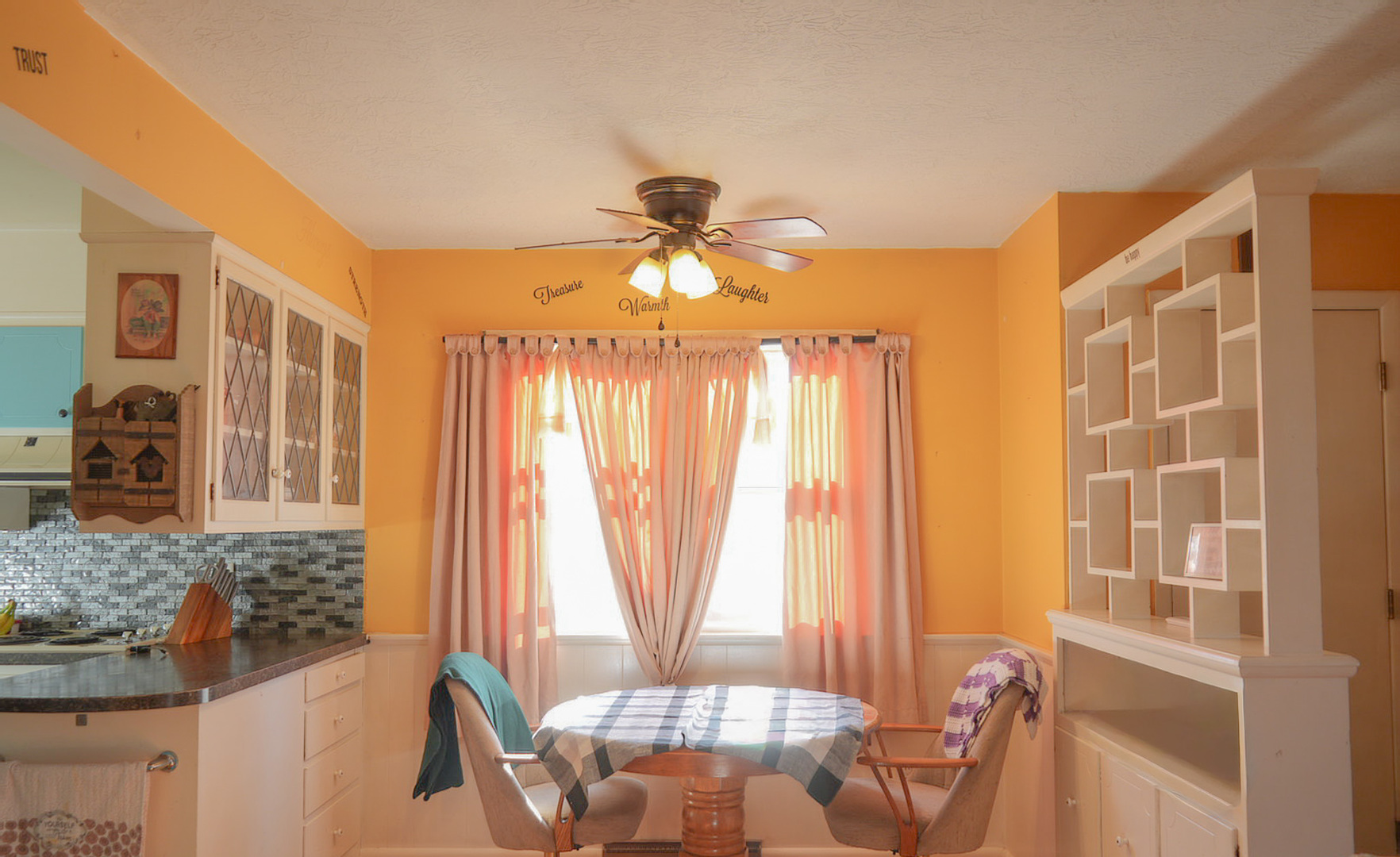 1843 31st Street Rock Island, IL 61201 - Photo 4 of 9 a living room with furniture and a chandelier
