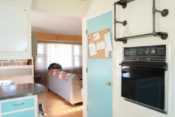 a kitchen with a stove and a refrigerator