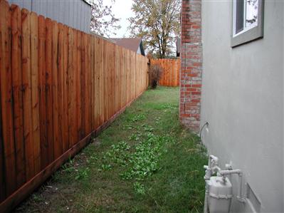 2627 Mohawk Street Santa Rosa, CA 95403 - Photo 8 of 12 a view of a pathway with a wooden fence