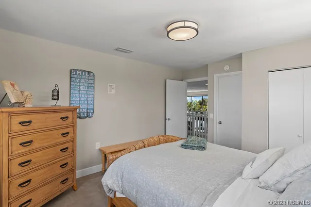 a bedroom with a bed and a dresser