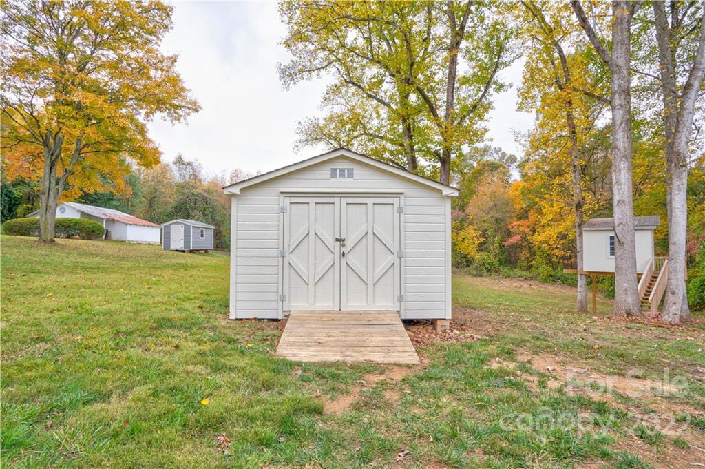 509 Roy Eaker Road Cherryville, NC 28021 - Photo 13 of 43 a front view of a house with garden