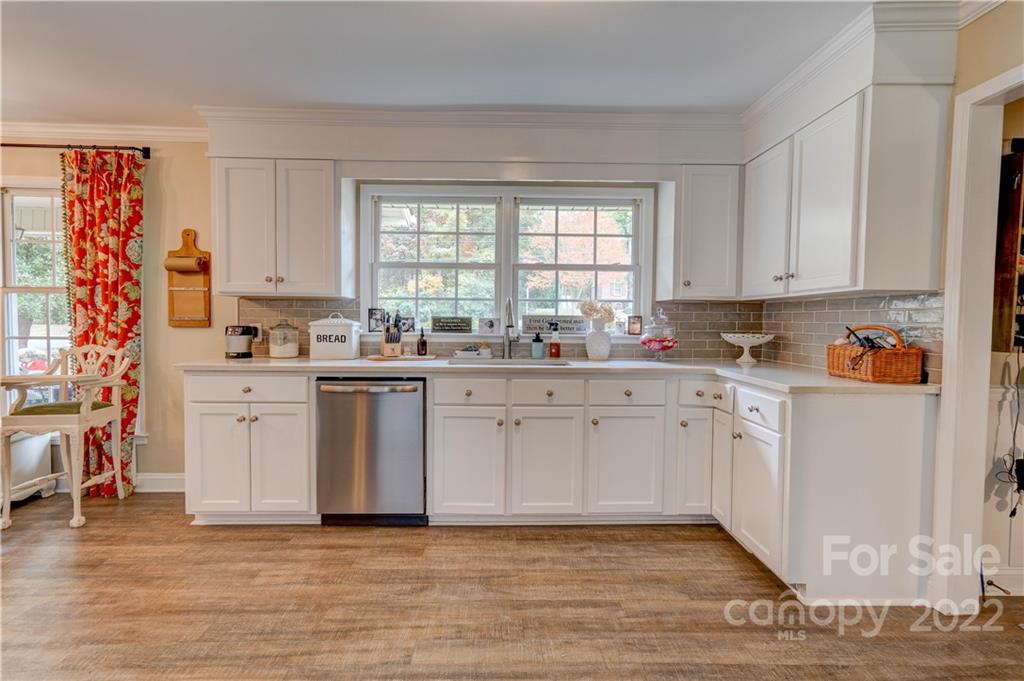 509 Roy Eaker Road Cherryville, NC 28021 - Photo 17 of 43 a kitchen with stainless steel appliances a stove a sink and white cabinets