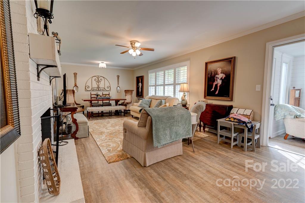 509 Roy Eaker Road Cherryville, NC 28021 - Photo 24 of 43 a living room with furniture kitchen view and a wooden floor