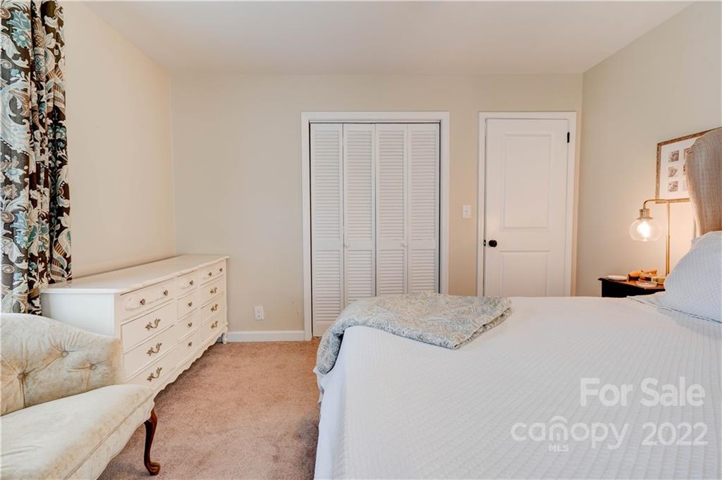509 Roy Eaker Road Cherryville, NC 28021 - Photo 27 of 43 a bedroom with a bed and cabinets
