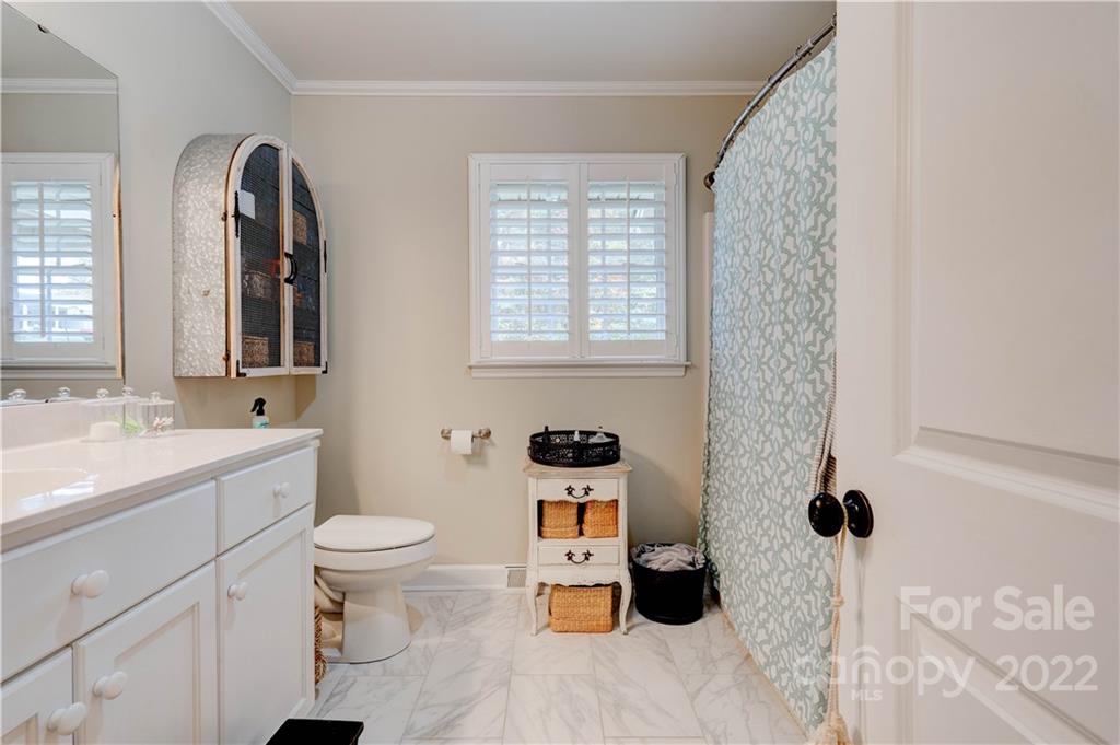 509 Roy Eaker Road Cherryville, NC 28021 - Photo 33 of 43 a bathroom with a sink toilet and shower