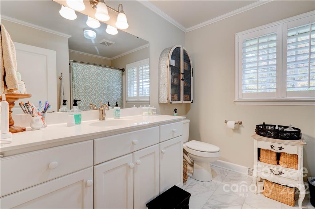 509 Roy Eaker Road Cherryville, NC 28021 - Photo 34 of 43 a bathroom with a sink a toilet and a mirror
