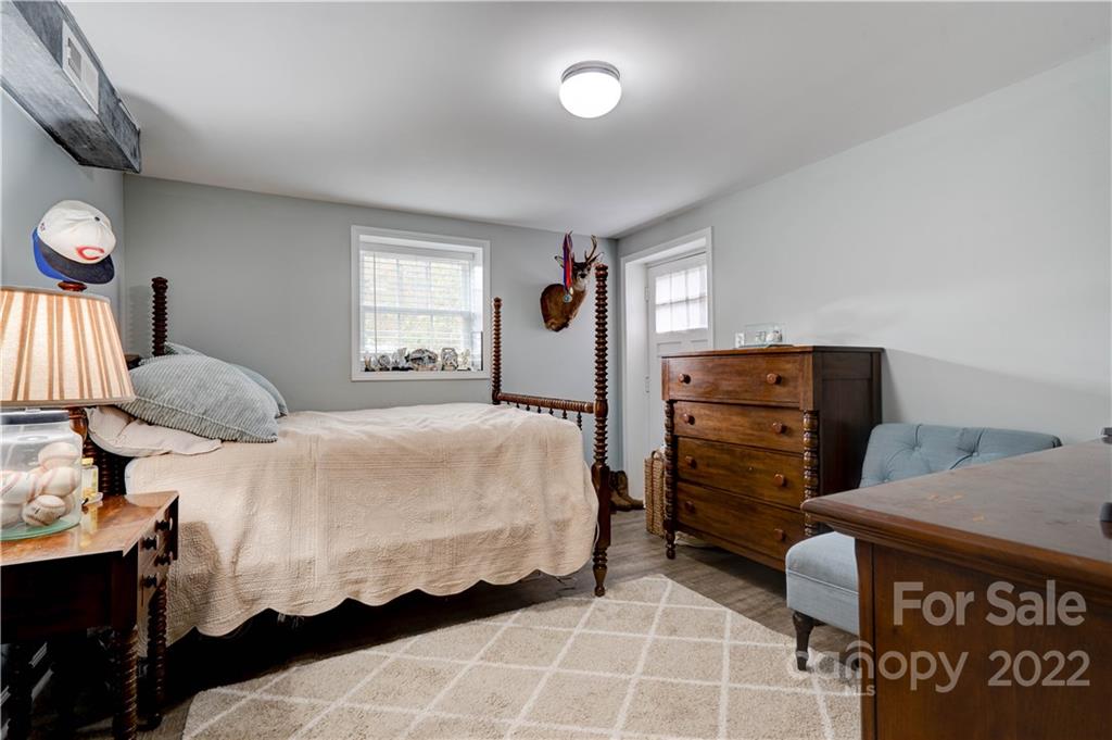 509 Roy Eaker Road Cherryville, NC 28021 - Photo 41 of 43 a bedroom with a bed and dresser