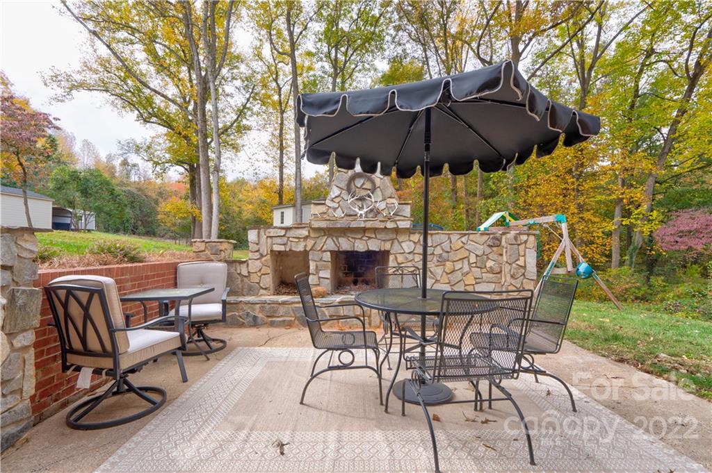 509 Roy Eaker Road Cherryville, NC 28021 - Photo 8 of 43 a view of a patio with furniture and a yard