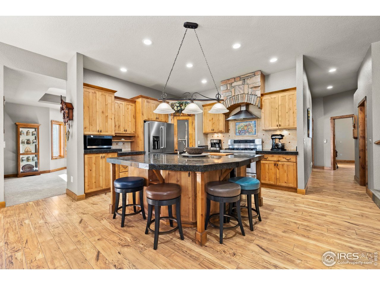952 Skinner Gulch Road Loveland, CO 80537 - Photo 12 of 43 Gourmet Kitchen into Formal Dining