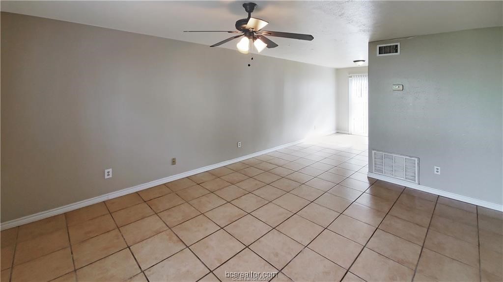 1908 Barak Lane, Unit 15 Bryan, TX 77802 - Photo 2 of 9 a view of an empty room and chandelier fan