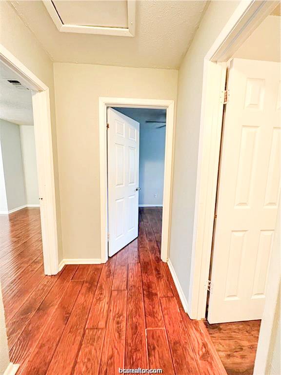 1908 Barak Lane, Unit 15 Bryan, TX 77802 - Photo 6 of 11 a view of a room with wooden floor and bench