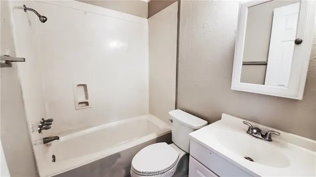 a bathroom with a sink toilet and bathtub