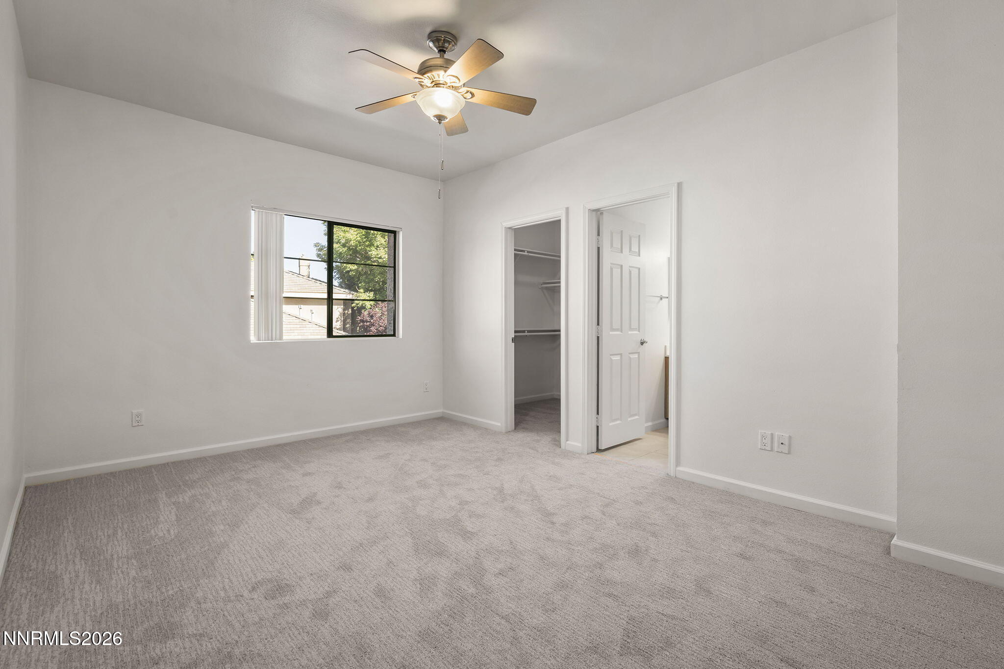 900 South Meadows Parkway, Unit 622 Reno, NV 89521 - Photo 13 of 30 an empty room with windows and closet