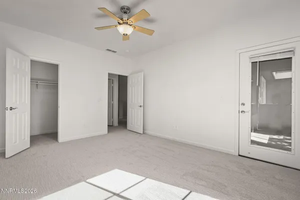 a view of an empty room with a bathroom