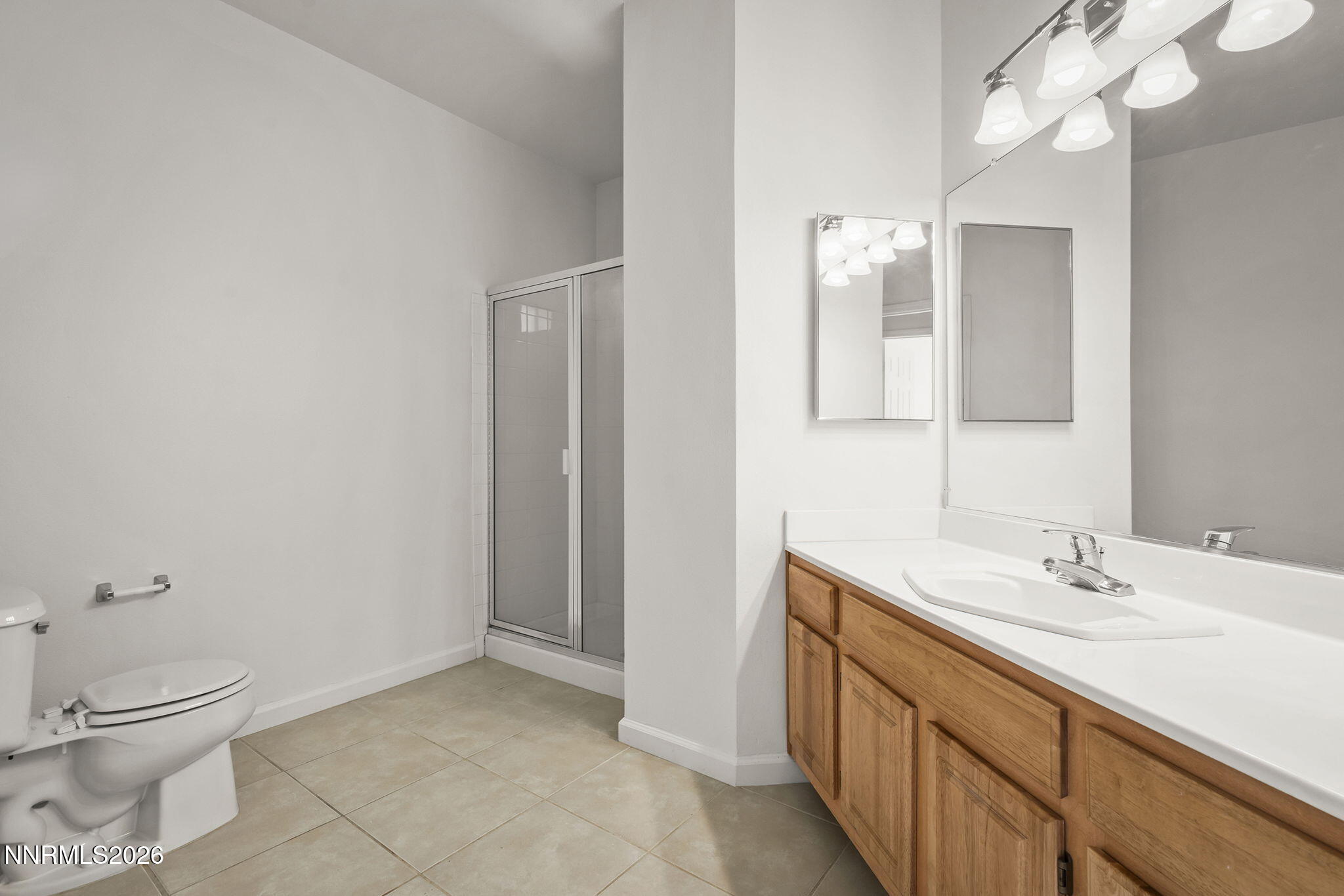 900 South Meadows Parkway, Unit 622 Reno, NV 89521 - Photo 19 of 30 a bathroom with a sink a toilet and a mirror